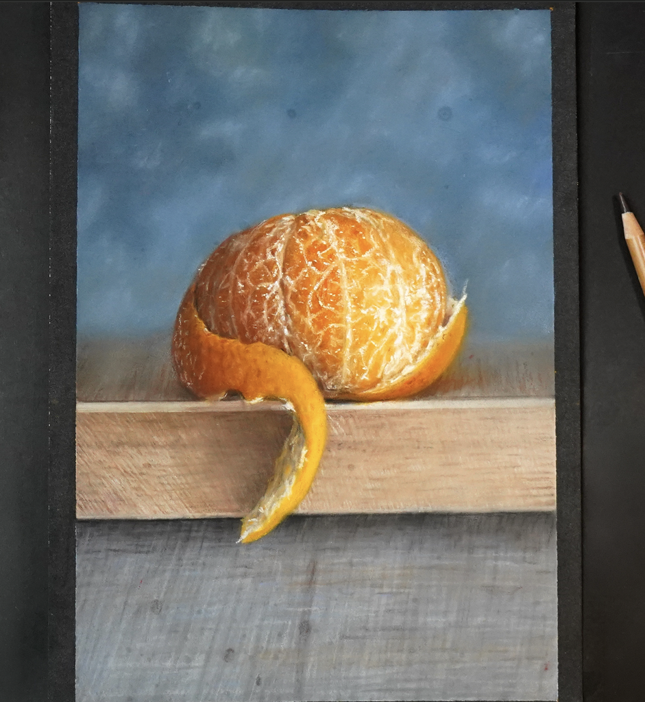 Mandarina con tiza pastel